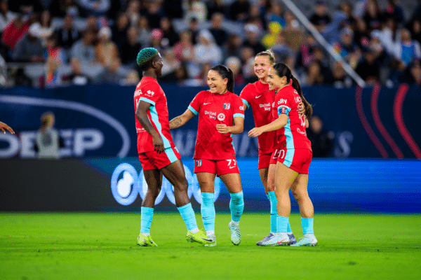 Temwa, Debinha, Claire and Lo are celebrating.