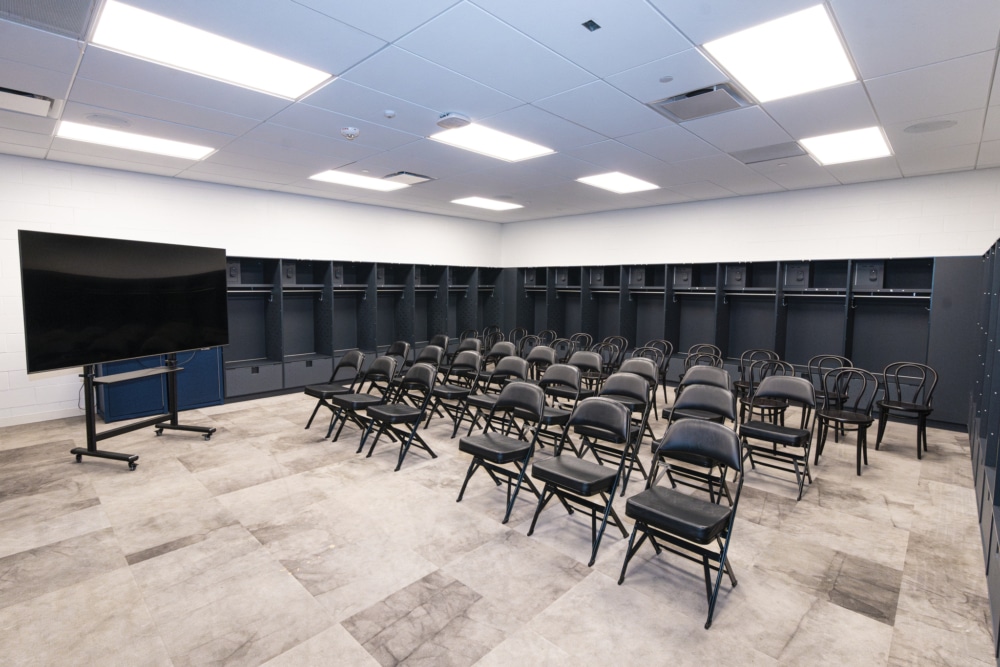 View of chairs setup in auxiliary locker room breakout room.