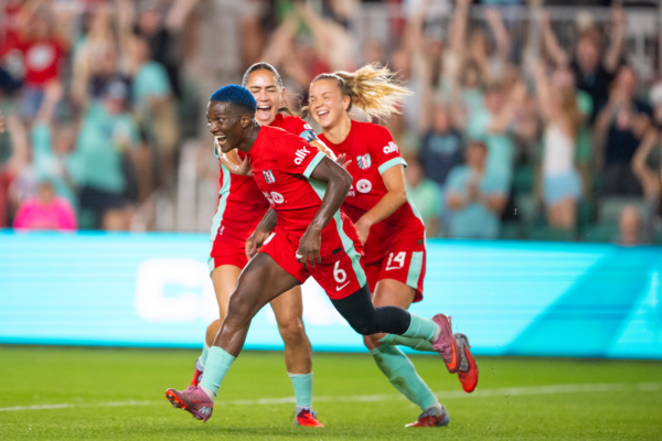 Temwa, Lo and Claire are celebrating.