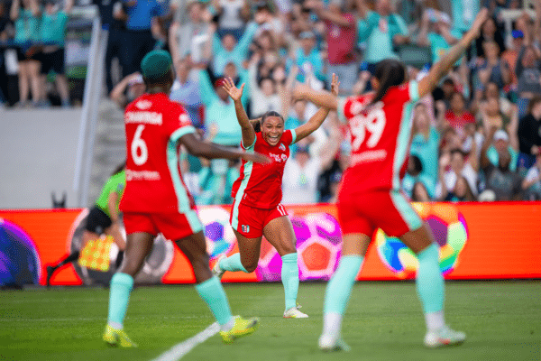 Temwa, Michelle and Debinha are celebrating.