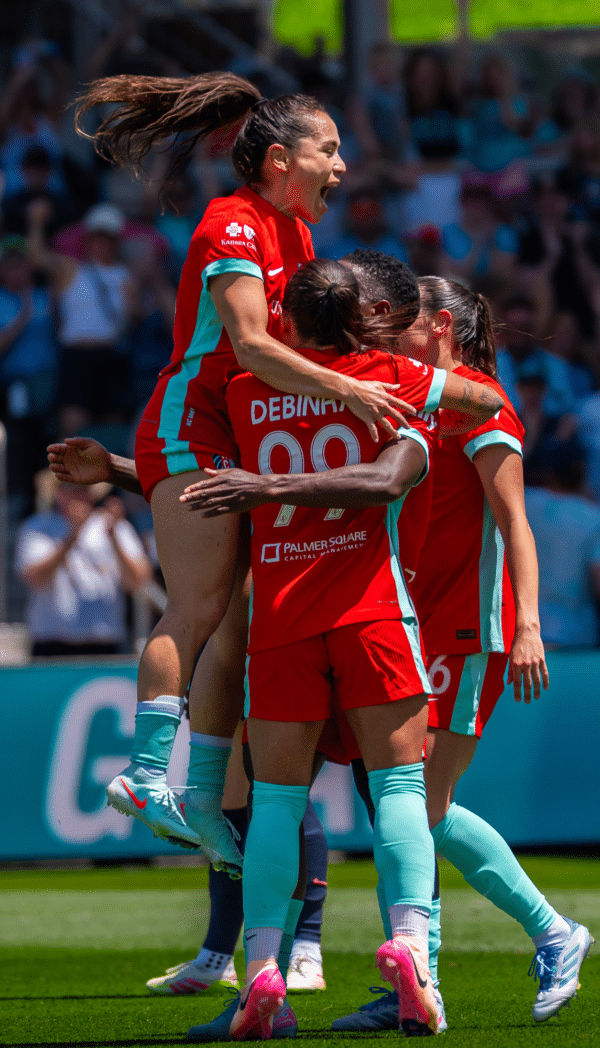 Lo, Temwa, and Debinha are celebrating.