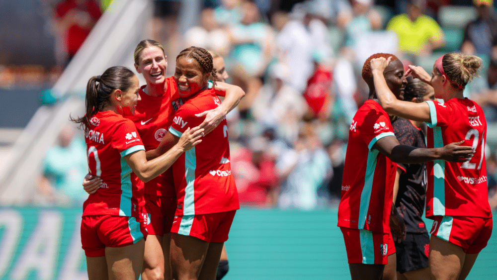 Lo, Haley and Laney celebrating goal.
