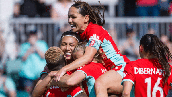 Chawinga, Bia, Lo and DiBernardo are celebrating a goal.