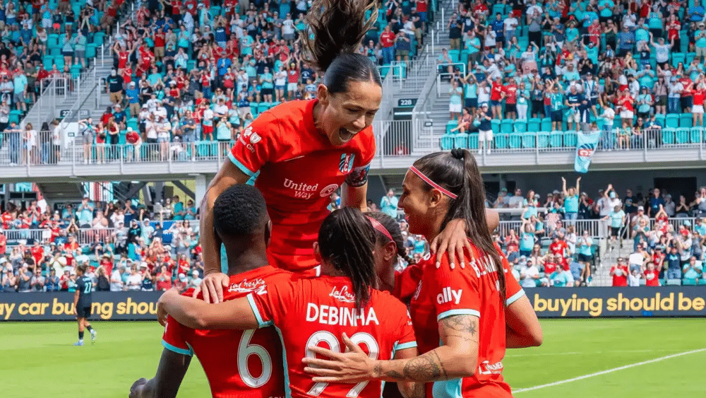 Chawinga. Deb, Bia, Cooper, and Lo are celebrating a goal.