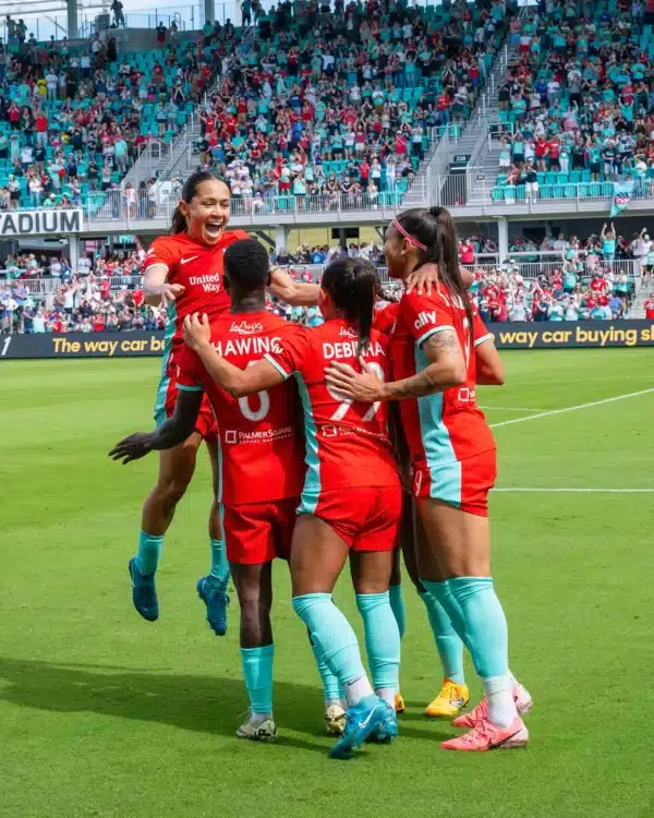 Lo, Chawinga, Deb and Bia are celebrating a goal.