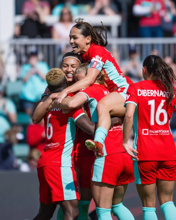 Chawinga, Bia, Lo and DiBernardo are celebrating a goal.